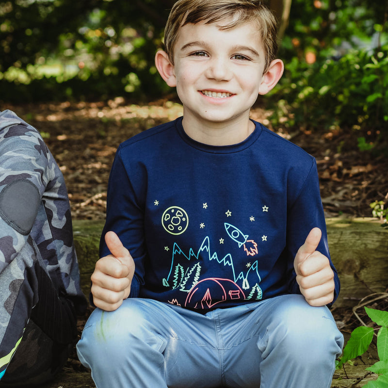 young boy outside with navy camp wesley tee giving thumbs up