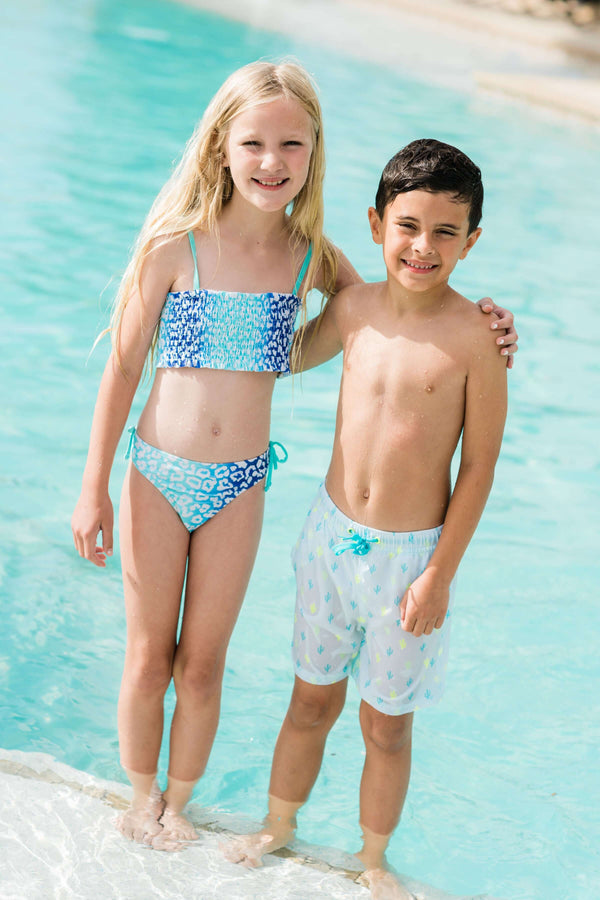 two kids at pool wearing EGG swimsuits